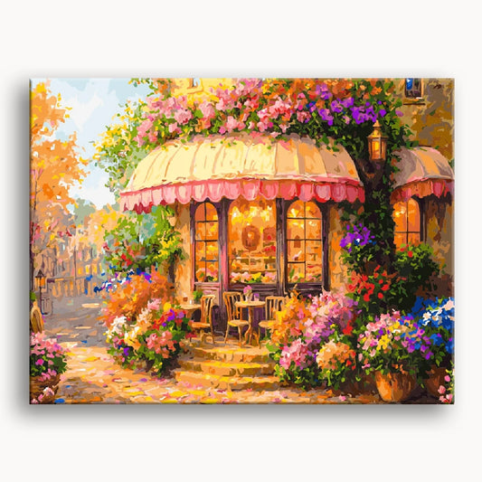 A vibrant painting of a cafe adorned with colorful flowers, creating a lively and inviting atmosphere.