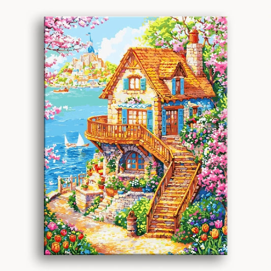 A painting depicting a house by the water, surrounded by vibrant flowers and lush trees.