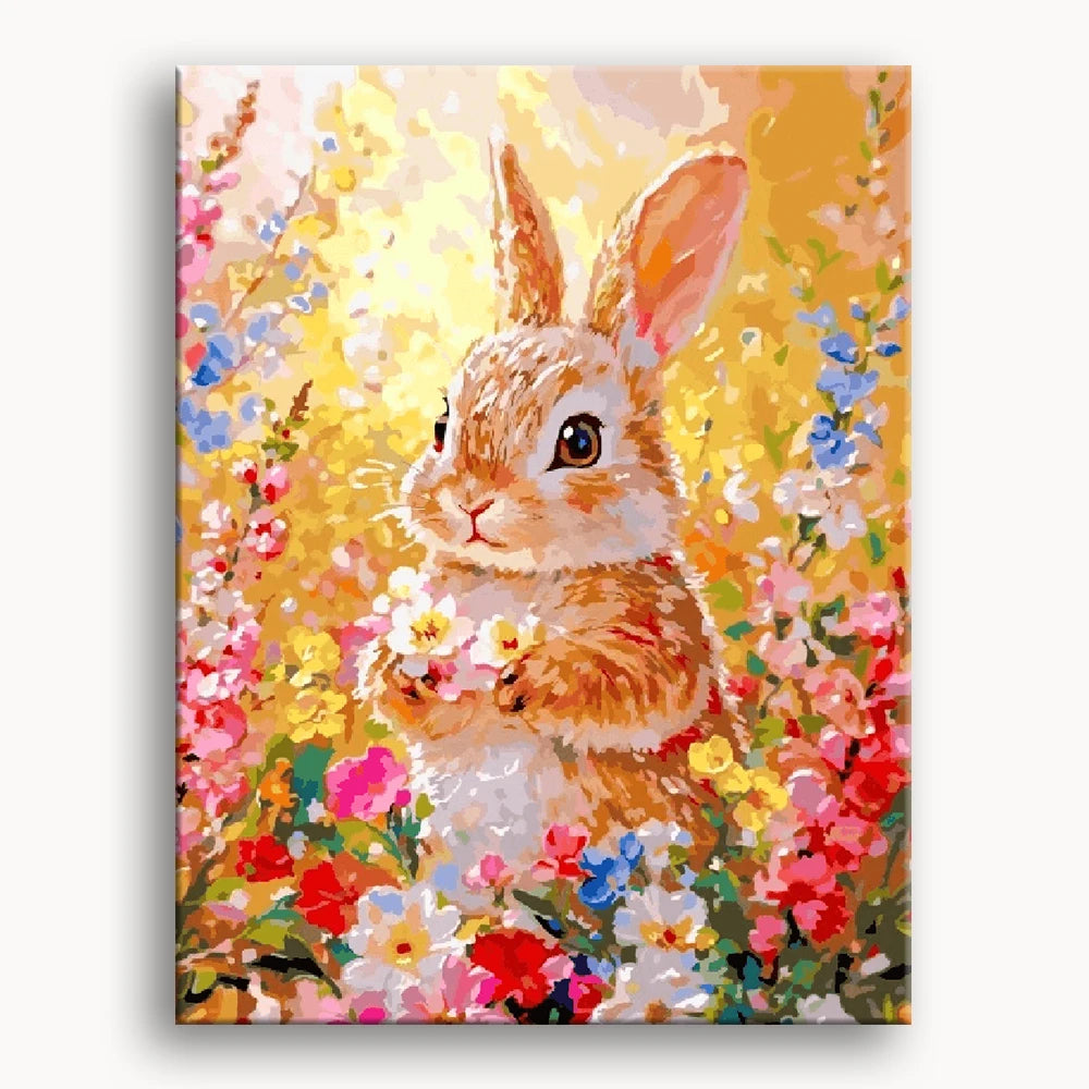 A colorful painting of a rabbit nestled among vibrant flowers in a sunny garden setting.